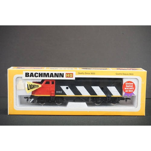 180 - Four boxed HO gauge locomotives to include Bachmann Deluxe EMD Diesel Canadian National, IHC M471 0-... 