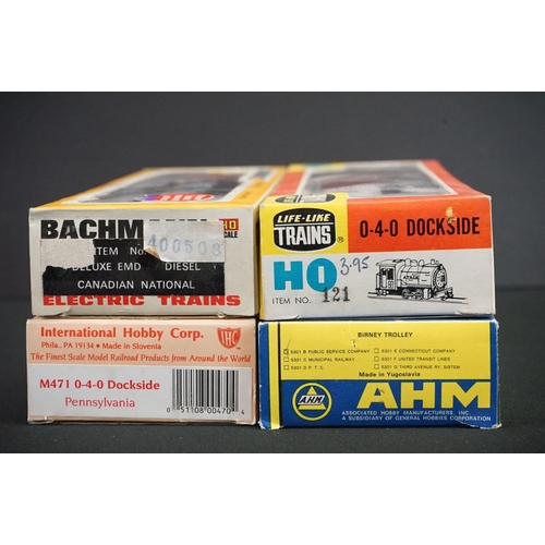 180 - Four boxed HO gauge locomotives to include Bachmann Deluxe EMD Diesel Canadian National, IHC M471 0-... 