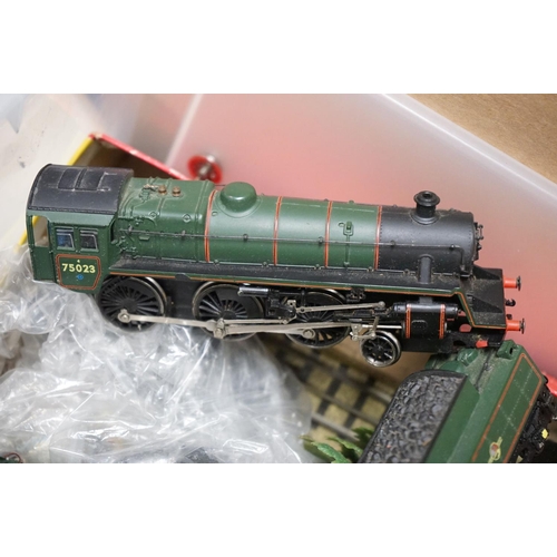 58 - Quantity of OO / HO gauge model railway to include engines, spares & repairs, rolling stock, tracksi... 