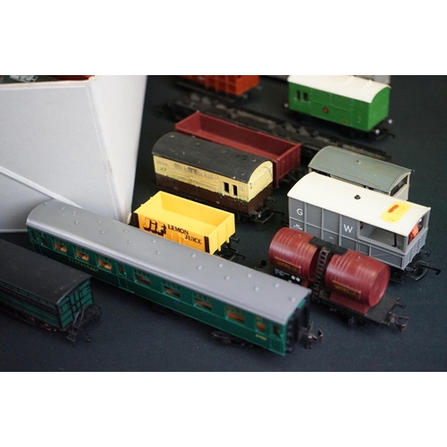 72 - Around 65 OO gauge items of rolling stock to include Triang, Jouef, Hornby etc, featuring wagons, co... 