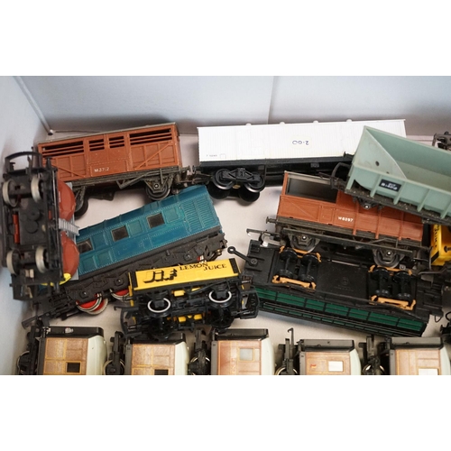 72 - Around 65 OO gauge items of rolling stock to include Triang, Jouef, Hornby etc, featuring wagons, co... 