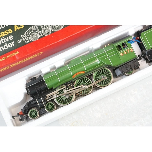 250 - Four boxed Hornby OO gauge locomotives to include R855 LNER Flying Scotsman, R068 BR Class 25 Diesel... 