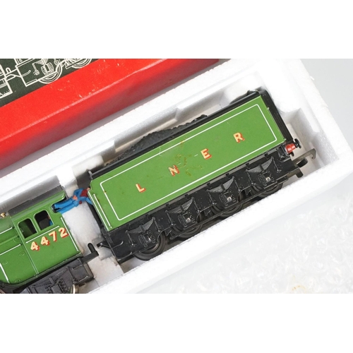 250 - Four boxed Hornby OO gauge locomotives to include R855 LNER Flying Scotsman, R068 BR Class 25 Diesel... 