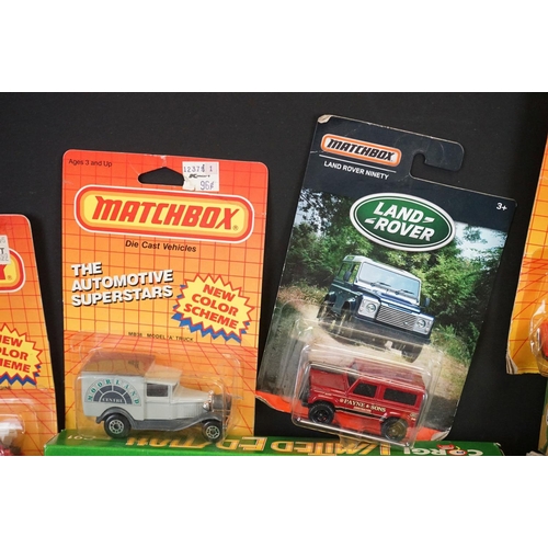 1128 - 33 Boxed / carded diecast models to include Matchbox, Corgi and Budgie