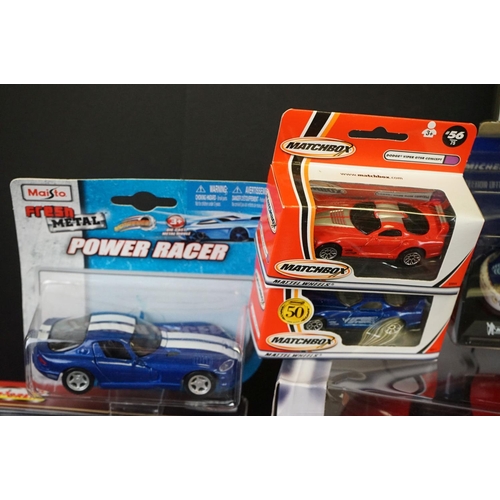 1133 - Around 35 boxed/carded/cased diecast models to include Maisto, Corgi, Matchbox, Majorette etc, dieca... 