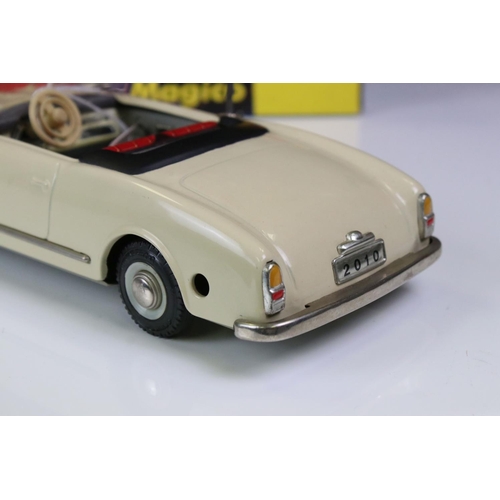 1256 - Original boxed Schuco 2010 Magico tin plate Alfa Romeo model in off white with red interior, with ke... 