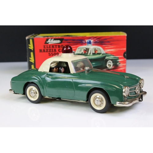 1257 - Original boxed Schuco Elektro Razzia Car 5509 tin plate model in evergreen with cream hood, with ins... 