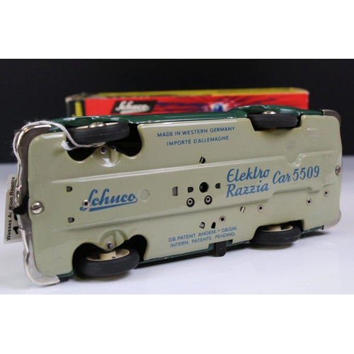 1257 - Original boxed Schuco Elektro Razzia Car 5509 tin plate model in evergreen with cream hood, with ins... 