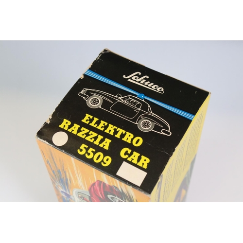 1257 - Original boxed Schuco Elektro Razzia Car 5509 tin plate model in evergreen with cream hood, with ins... 