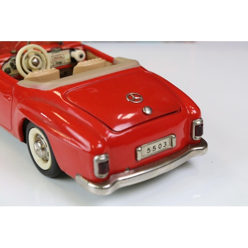 1258 - Original boxed Schuco 5503 Elektro Phanomenal tin plate car in red with 4 x wooden pegs & remote con... 