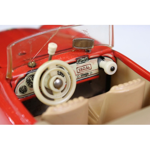 1258 - Original boxed Schuco 5503 Elektro Phanomenal tin plate car in red with 4 x wooden pegs & remote con... 