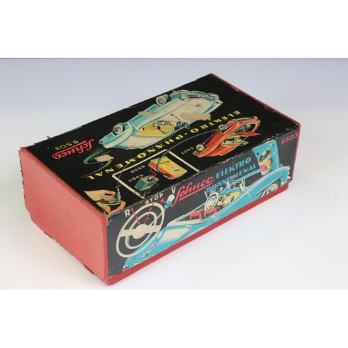 1258 - Original boxed Schuco 5503 Elektro Phanomenal tin plate car in red with 4 x wooden pegs & remote con... 