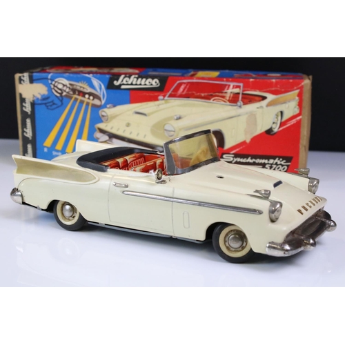 1259 - Boxed Schuco Synchromatic 5700 tin plate Packard model with white body and beige fins, red interior,... 