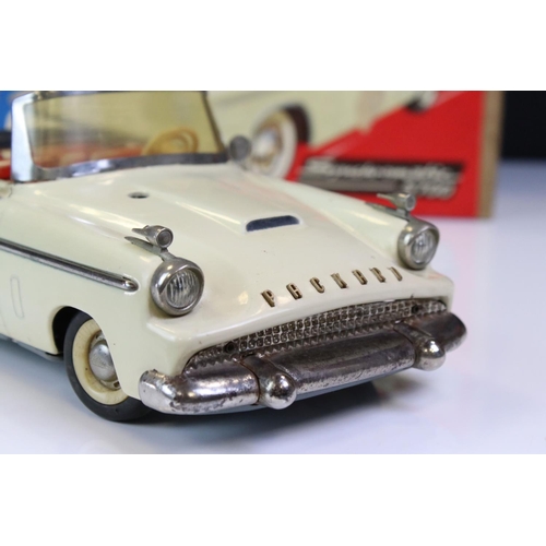 1259 - Boxed Schuco Synchromatic 5700 tin plate Packard model with white body and beige fins, red interior,... 