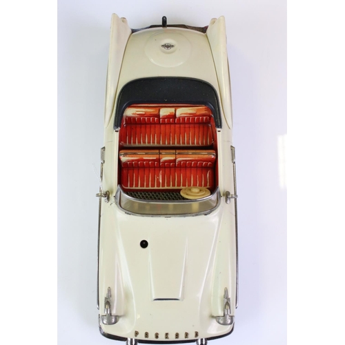 1259 - Boxed Schuco Synchromatic 5700 tin plate Packard model with white body and beige fins, red interior,... 