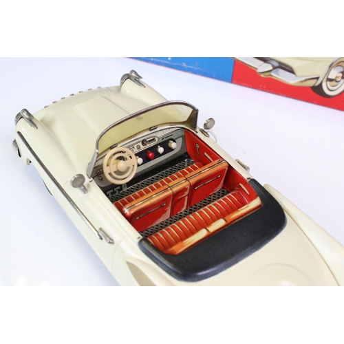 1259 - Boxed Schuco Synchromatic 5700 tin plate Packard model with white body and beige fins, red interior,... 