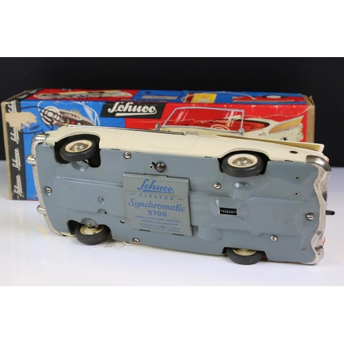 1259 - Boxed Schuco Synchromatic 5700 tin plate Packard model with white body and beige fins, red interior,... 