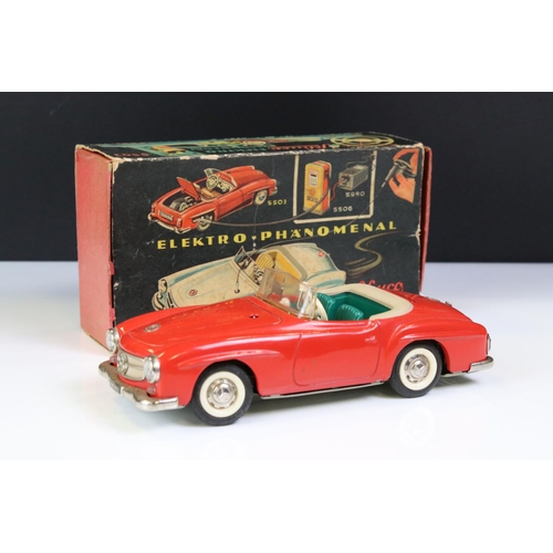 1262 - Original boxed Schuco 5503 Elektro Phanomenal tin plate car in red complete with 6 x wooden pegs, re... 