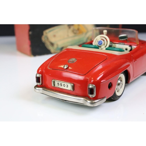 1262 - Original boxed Schuco 5503 Elektro Phanomenal tin plate car in red complete with 6 x wooden pegs, re... 