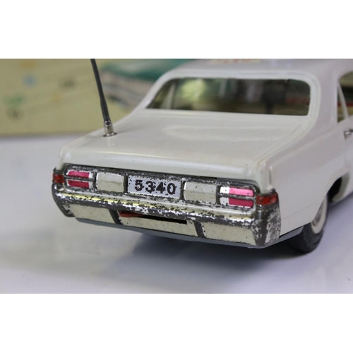 1263 - Boxed Schuco Alarm-Car 5340 Opel Admiral tin plate Police car in white, with aerial, blue light and ... 