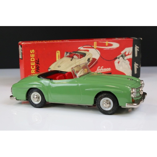 1264 - Boxed Schuco 2095 Mercedes 190SL tin plate clockwork car in green with red interior, complete with k... 