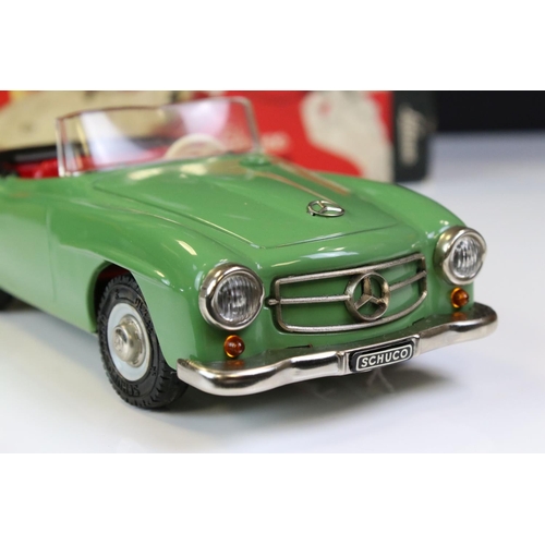 1264 - Boxed Schuco 2095 Mercedes 190SL tin plate clockwork car in green with red interior, complete with k... 