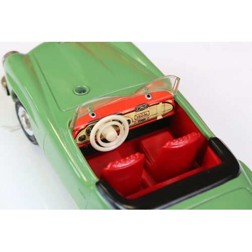 1264 - Boxed Schuco 2095 Mercedes 190SL tin plate clockwork car in green with red interior, complete with k... 