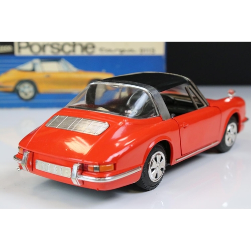 1265 - Boxed Schuco clockwork Porsche Targa 911S in red with black roof, vg condition with only minor paint... 