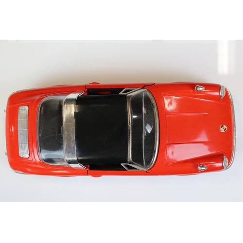 1265 - Boxed Schuco clockwork Porsche Targa 911S in red with black roof, vg condition with only minor paint... 