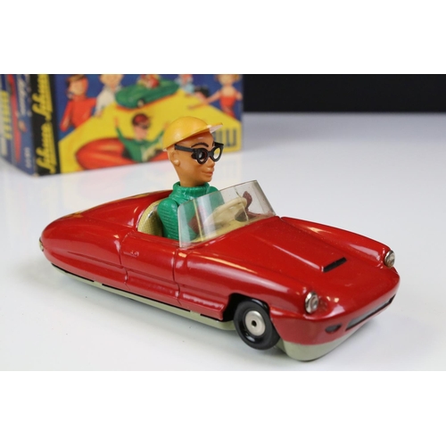 1266 - Boxed Dalli 1011 tin plate clockwork car in red, with driver in yellow cap and black glasses, minima... 