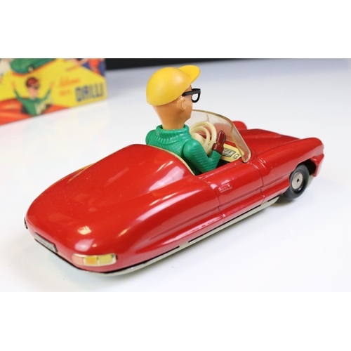 1266 - Boxed Dalli 1011 tin plate clockwork car in red, with driver in yellow cap and black glasses, minima... 