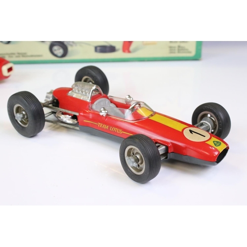 1267 - Boxed Schuco 1079 Dynamo Lotus tin plate F1 racing car with remote controller, in red, race number 1... 