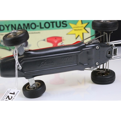 1267 - Boxed Schuco 1079 Dynamo Lotus tin plate F1 racing car with remote controller, in red, race number 1... 