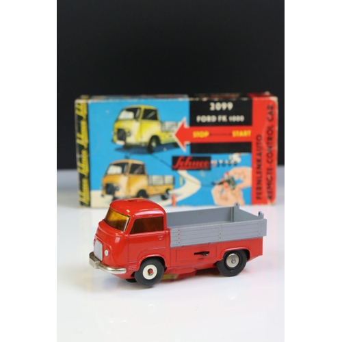 1272 - Boxed Schuco 2099 Ford FK 1000 tin plate clockwork Remote Control Car in red with grey, complete wit... 