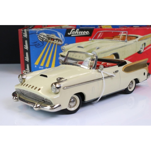 1275A - Boxed Schuco Synchromatic 5700 tin plate Packard model with white body and beige fins, red interior,... 