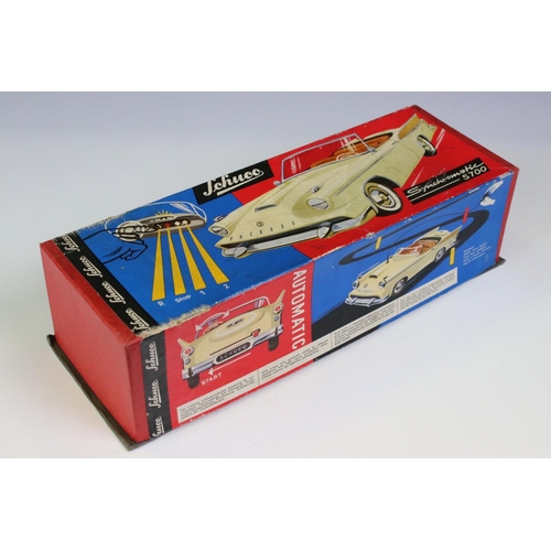 1275A - Boxed Schuco Synchromatic 5700 tin plate Packard model with white body and beige fins, red interior,... 