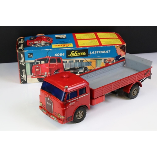 1276 - Boxed Schuco 6084 Lastomat tin plate model in red with instructions and remote control steering whee... 