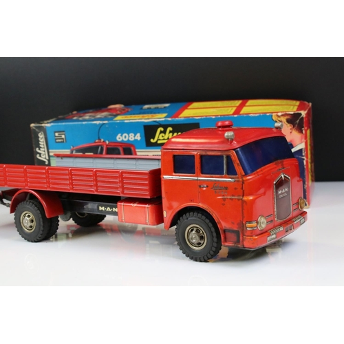 1276 - Boxed Schuco 6084 Lastomat tin plate model in red with instructions and remote control steering whee... 