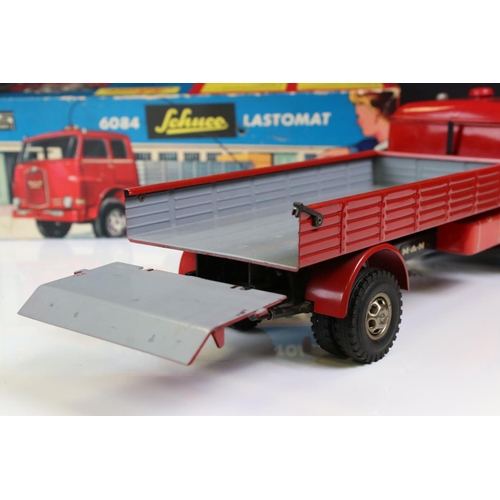 1276 - Boxed Schuco 6084 Lastomat tin plate model in red with instructions and remote control steering whee... 