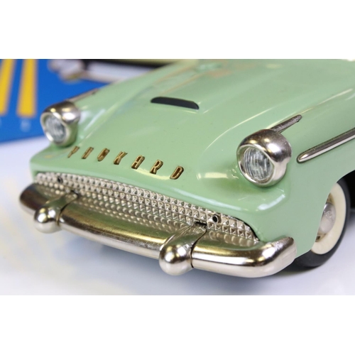 1276A - Boxed Schuco Synchromatic 5700 tin plate Packard model with pale green body and beige fins, red inte... 