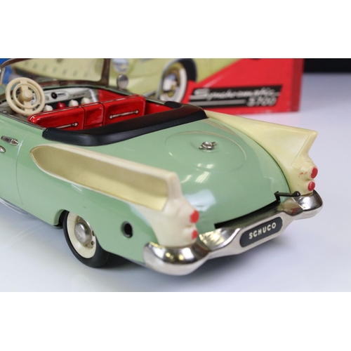 1276A - Boxed Schuco Synchromatic 5700 tin plate Packard model with pale green body and beige fins, red inte... 