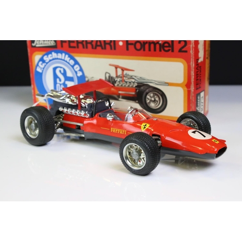 1285 - Two boxed Schuco Formel 2 models, both in red and with keys, one missing rear spoiler, one with FC S... 