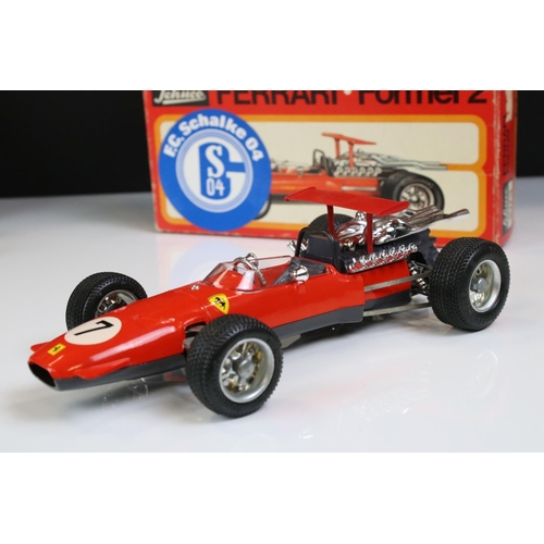 1285 - Two boxed Schuco Formel 2 models, both in red and with keys, one missing rear spoiler, one with FC S... 