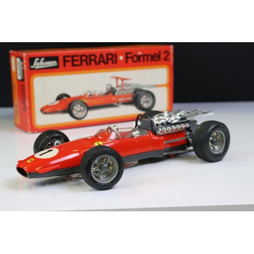 1285 - Two boxed Schuco Formel 2 models, both in red and with keys, one missing rear spoiler, one with FC S... 