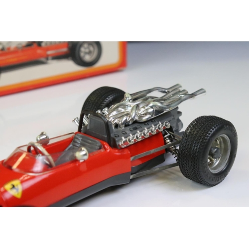 1285 - Two boxed Schuco Formel 2 models, both in red and with keys, one missing rear spoiler, one with FC S... 