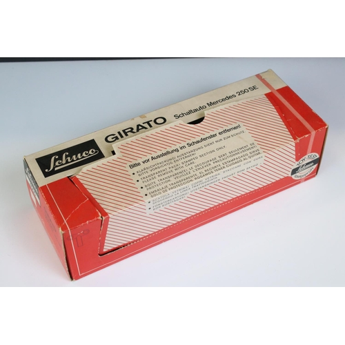 1287 - Boxed Schuco 4000 Girato Schaltauto Mercedes 250 SE in red, model ex, some box wear with window spli... 