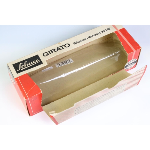 1287 - Boxed Schuco 4000 Girato Schaltauto Mercedes 250 SE in red, model ex, some box wear with window spli... 