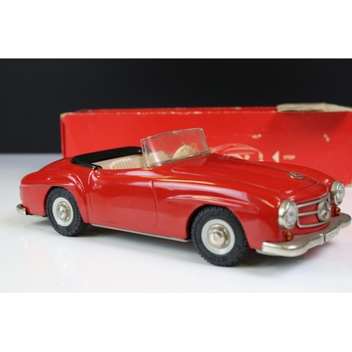 1291 - Schuco Clockwork tinplate remote control 2095 Mercedes 190 SL in red, with instructions and box tray