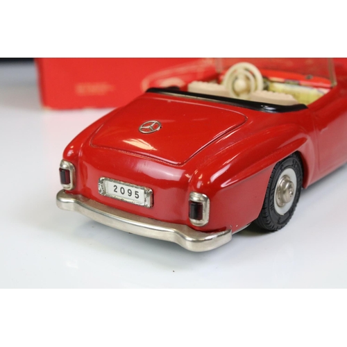 1291 - Schuco Clockwork tinplate remote control 2095 Mercedes 190 SL in red, with instructions and box tray