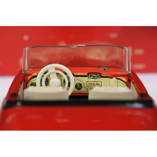 1291 - Schuco Clockwork tinplate remote control 2095 Mercedes 190 SL in red, with instructions and box tray